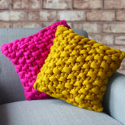 bright pink knitted cushion